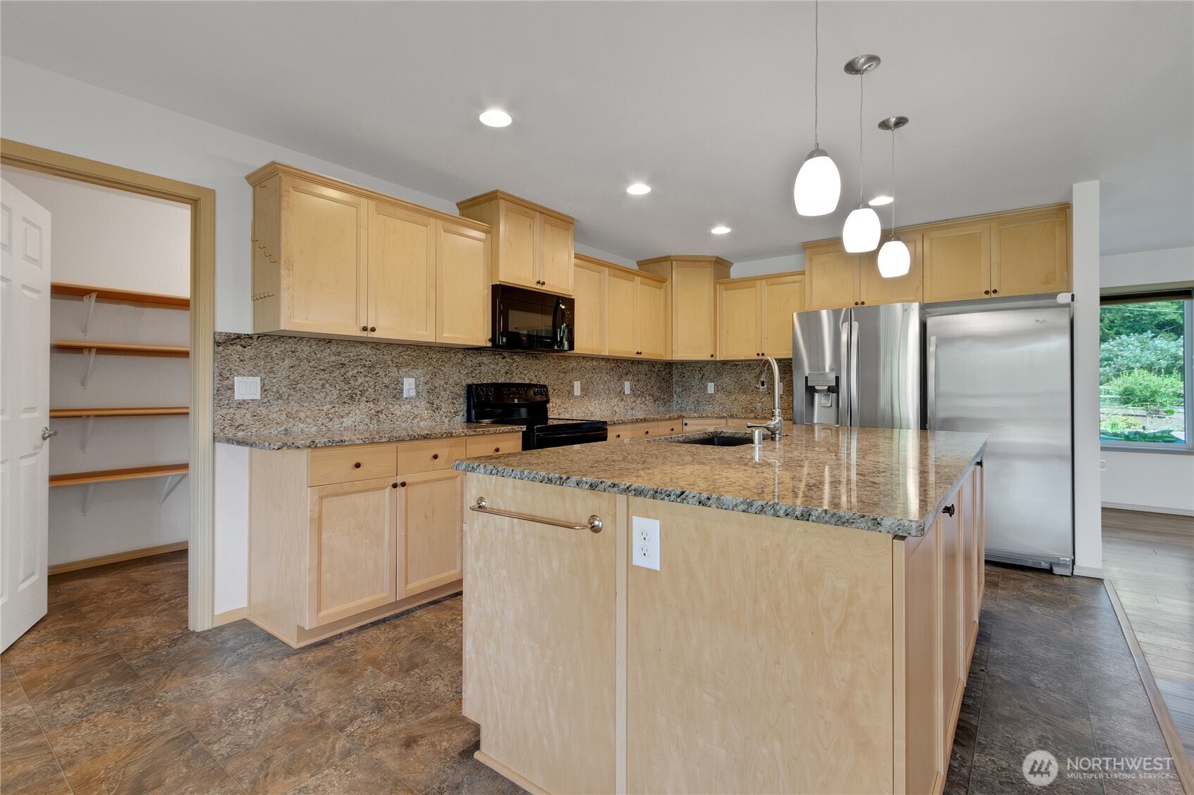 1450 Southeast Spruce Road Port Orchard, WA 98367 - Photo 10 of 39 a kitchen with kitchen island granite countertop appliances cabinets and a sink