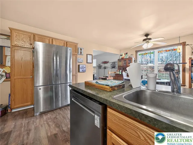 a dining room with a wooden table and chairs
