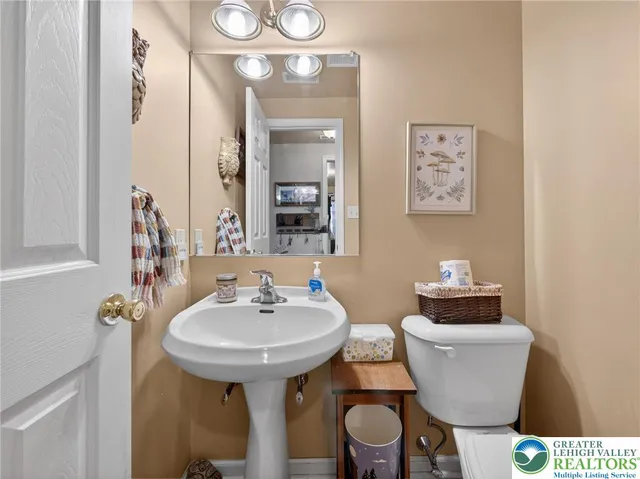 a bedroom with a bed and a night stand in it