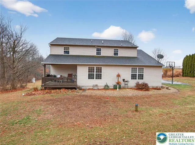 a view of a house with a snow in the yard