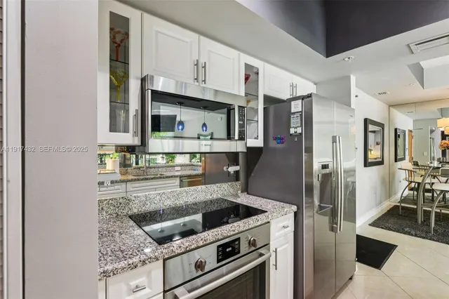 a bedroom with a bed a couch and a window