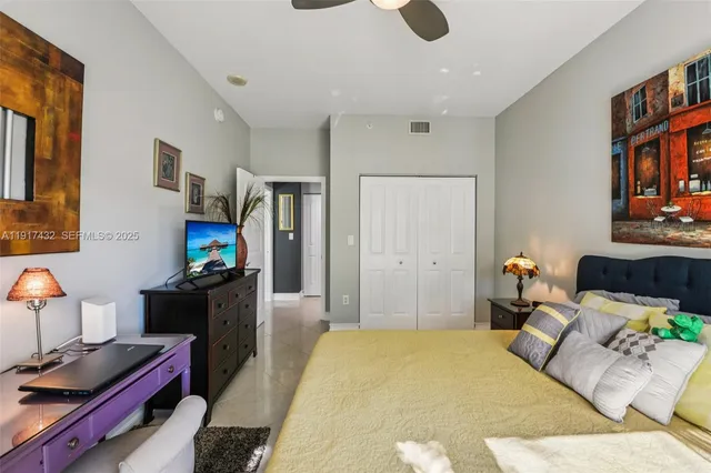a bathroom with a granite countertop sink a toilet and shower