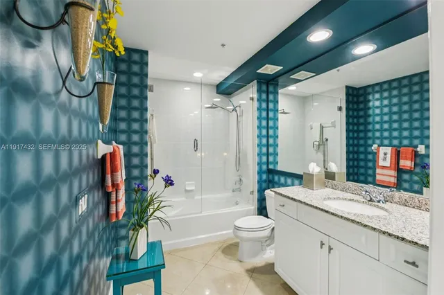 a view of balcony with couple of potted plants