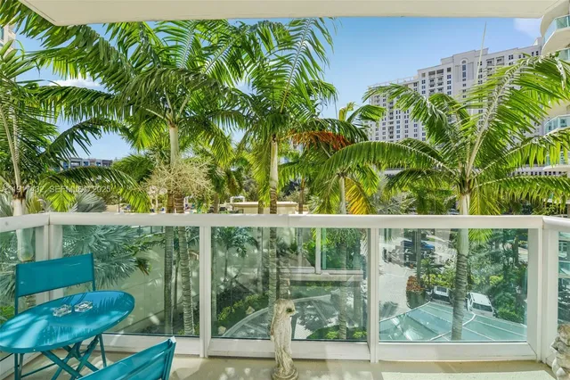 a balcony with view of outdoor space