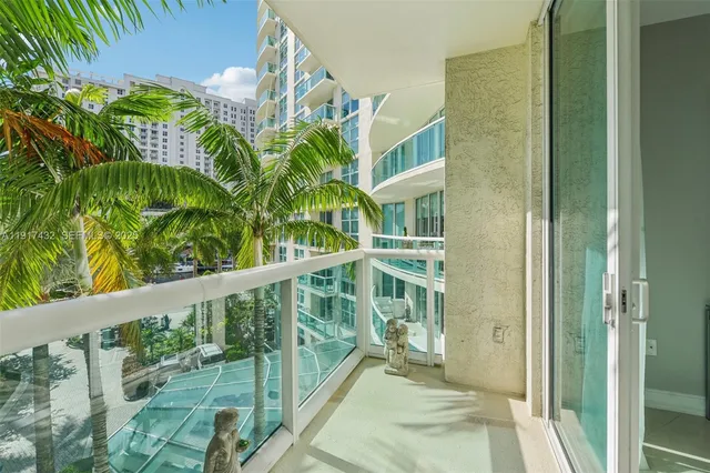a view of swimming pool with a yard and potted plants