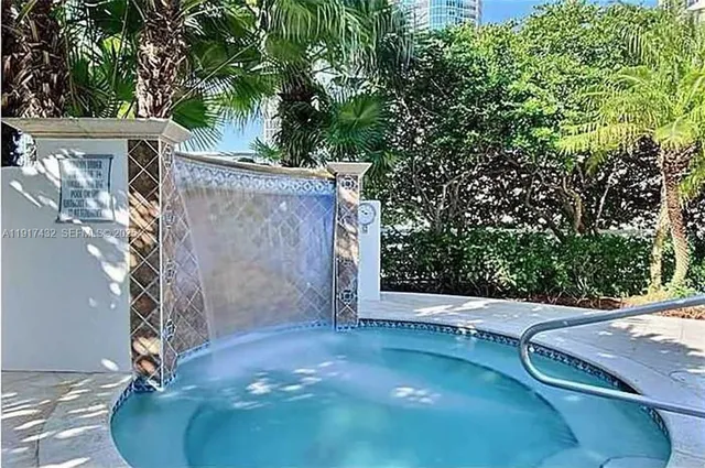a view of a swimming pool with chairs