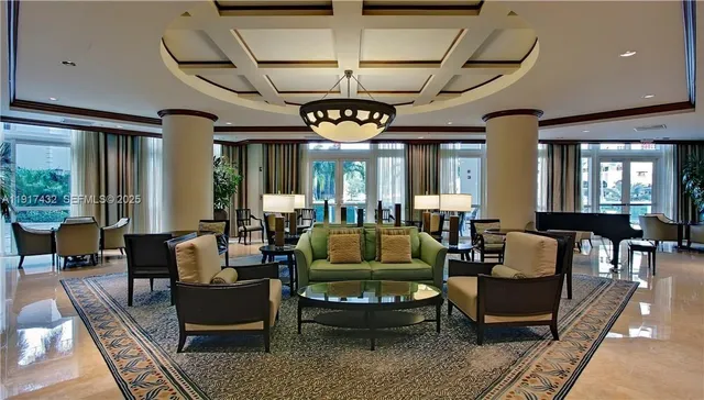 a living room with furniture a flat screen tv and a table