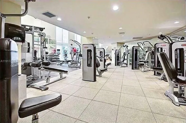 a kitchen with stainless steel appliances a stove and cabinets