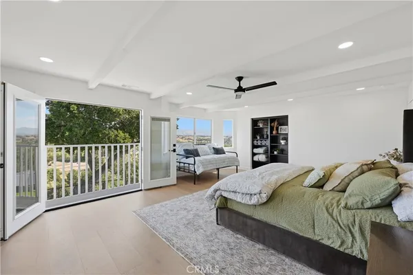 a living room with furniture ceiling fan and a rug