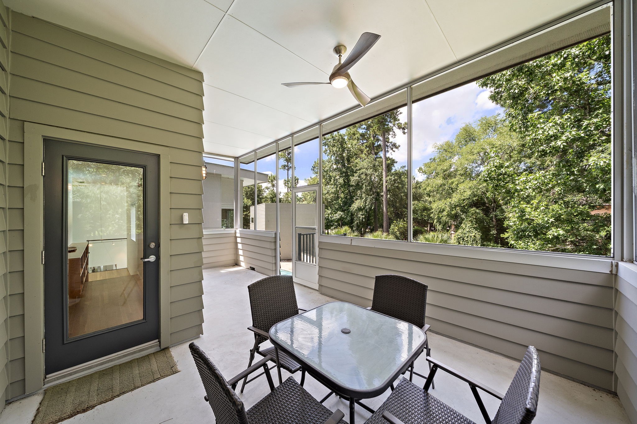 118 Angel Leaf Road Spring, TX 77380 - Photo 28 of 50 Covered outdoor lounge with direct views of the wooded surroundings.