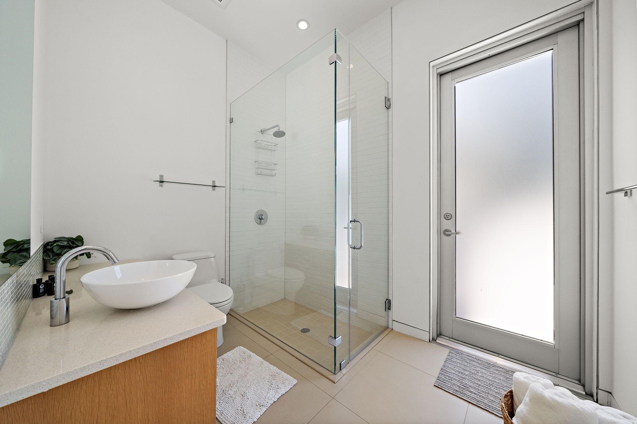 118 Angel Leaf Road Spring, TX 77380 - Photo 34 of 50 Spa-inspired bathroom with elegant tilework and glass shower.
