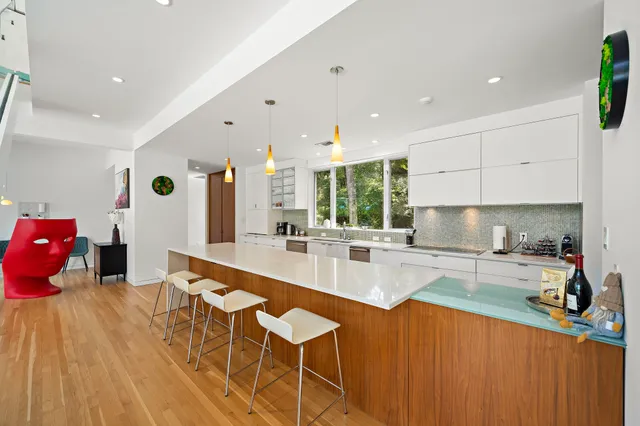 a kitchen with stainless steel appliances granite countertop a sink and cabinets