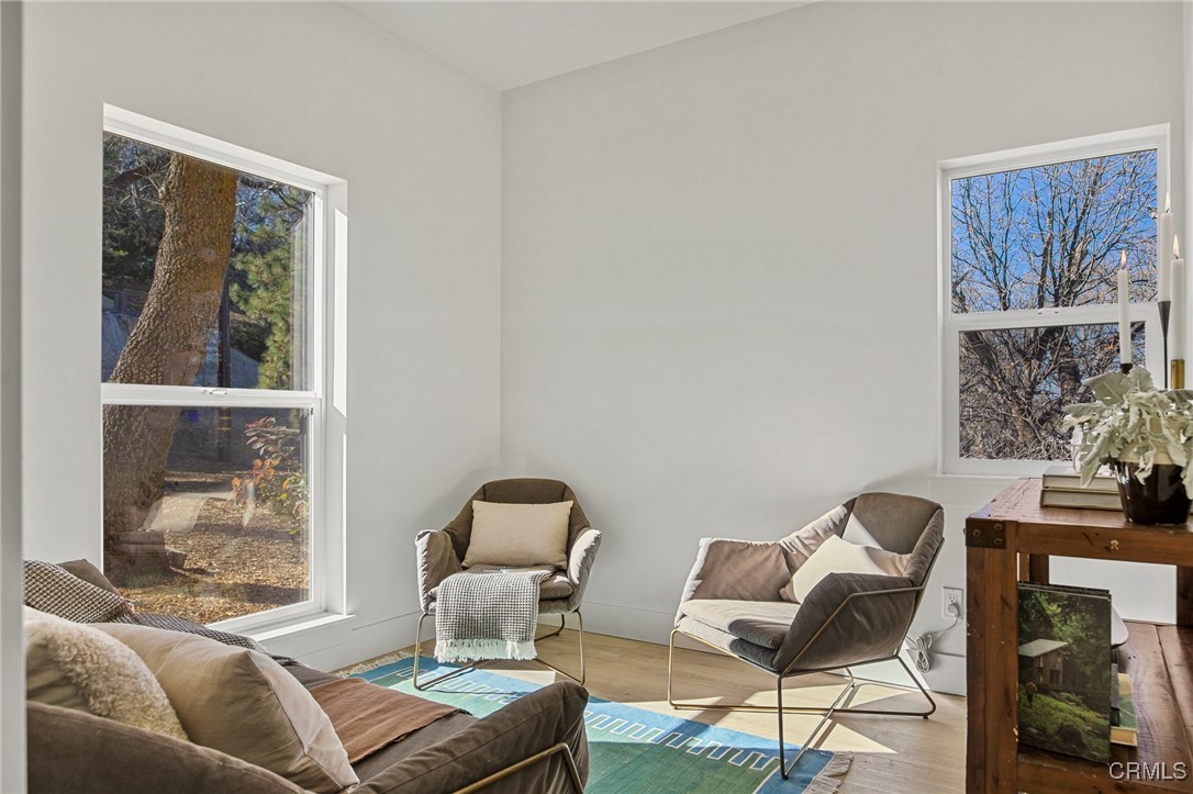 26880 Abner Drive Lake Arrowhead, CA 92352 - Photo 11 of 36 a living room with furniture and a window