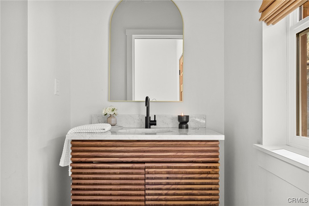 26880 Abner Drive Lake Arrowhead, CA 92352 - Photo 13 of 36 a close up of a mirror and a sink