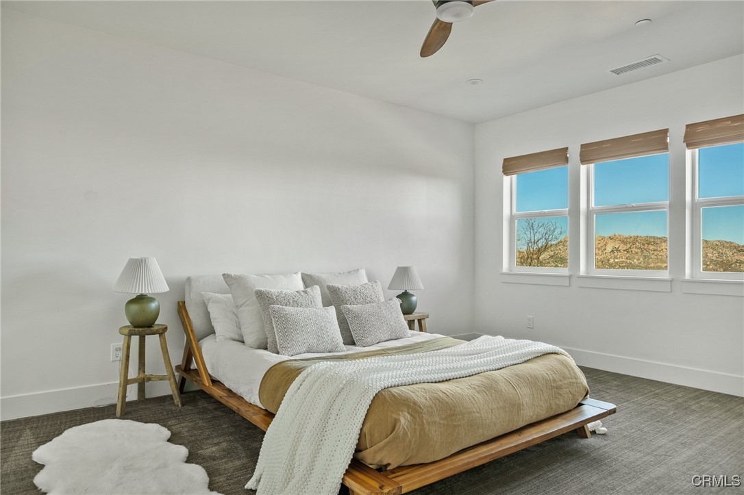 26880 Abner Drive Lake Arrowhead, CA 92352 - Photo 15 of 36 a bedroom with a bed and window