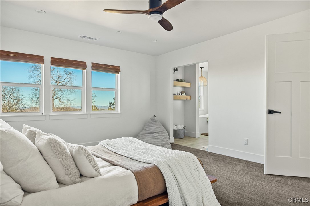 26880 Abner Drive Lake Arrowhead, CA 92352 - Photo 16 of 36 a bedroom with a bed and a window
