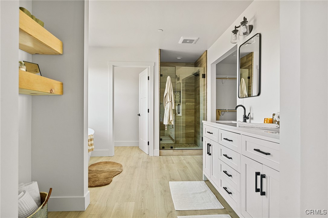 26880 Abner Drive Lake Arrowhead, CA 92352 - Photo 18 of 36 a bathroom with a sink a mirror and shower