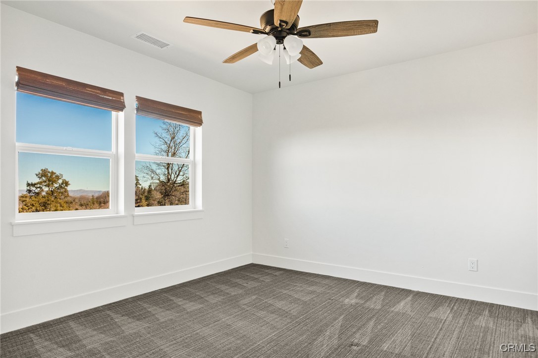 26880 Abner Drive Lake Arrowhead, CA 92352 - Photo 27 of 36 an empty room with a window and a ceiling fan