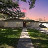 a front view of a house with yard