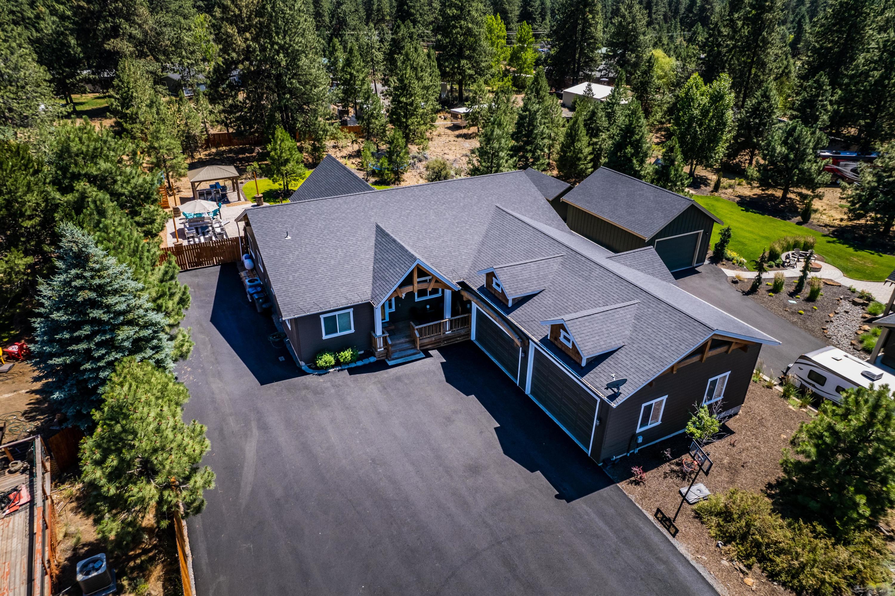 19525 Apache Road Bend, OR 97702 - Photo 43 of 47 an aerial view of a house with swimming pool and glass doors