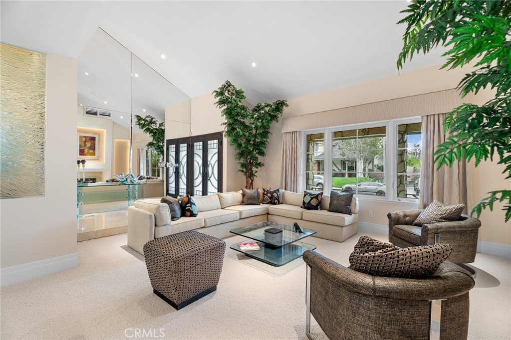 18927 Granada Circle Porter Ranch, CA 91326 - Photo 11 of 75 a living room with furniture potted plant and a large window