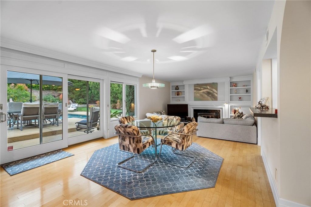 18927 Granada Circle Porter Ranch, CA 91326 - Photo 15 of 75 a living room with fireplace furniture and a large window