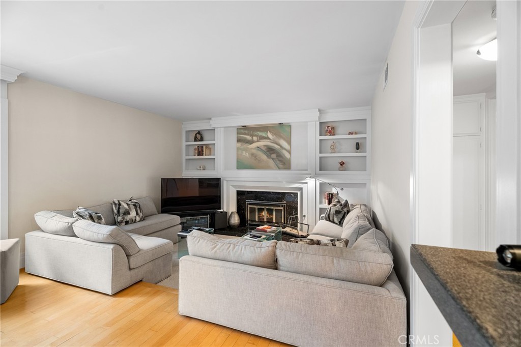 18927 Granada Circle Porter Ranch, CA 91326 - Photo 17 of 75 a living room with furniture and a fireplace