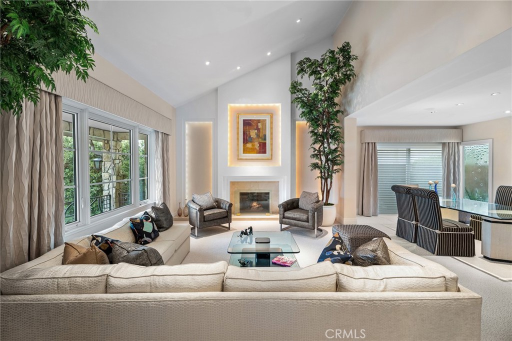 18927 Granada Circle Porter Ranch, CA 91326 - Photo 2 of 75 a living room with furniture large window and potted plants