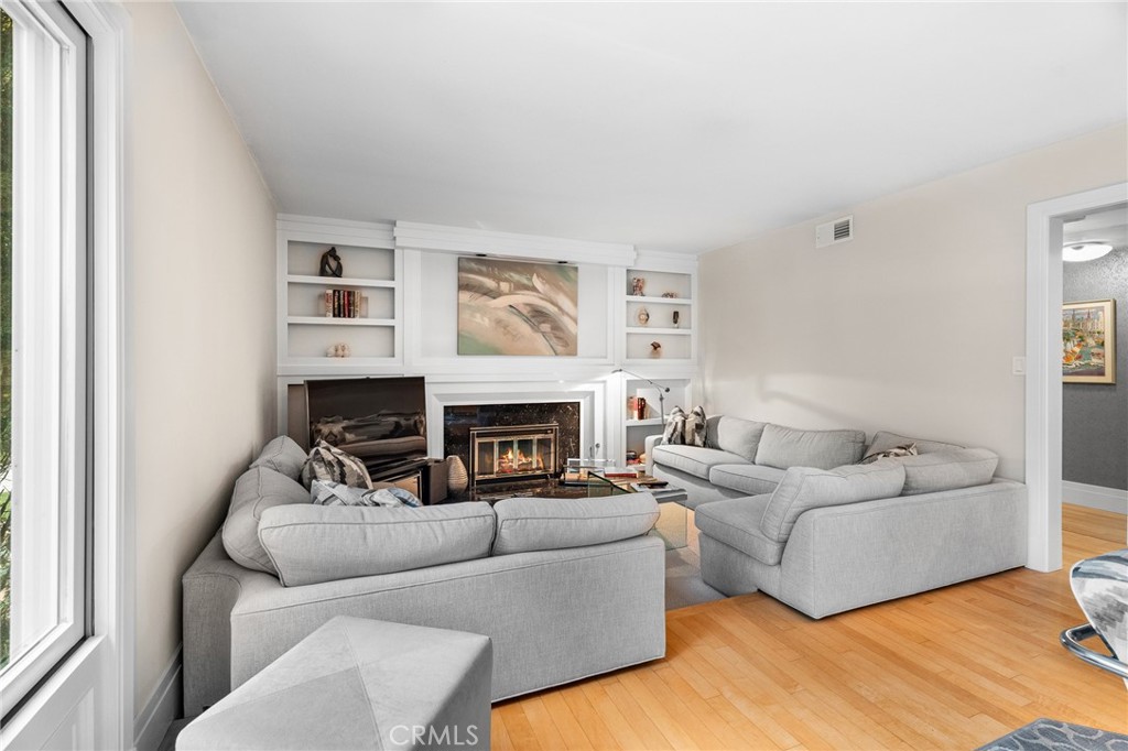 18927 Granada Circle Porter Ranch, CA 91326 - Photo 22 of 75 a living room with furniture and a fireplace