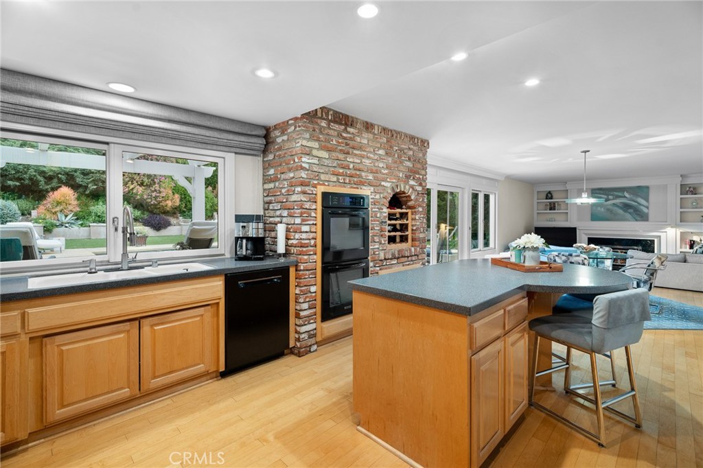 18927 Granada Circle Porter Ranch, CA 91326 - Photo 28 of 75 a kitchen with stainless steel appliances granite countertop a stove and a sink