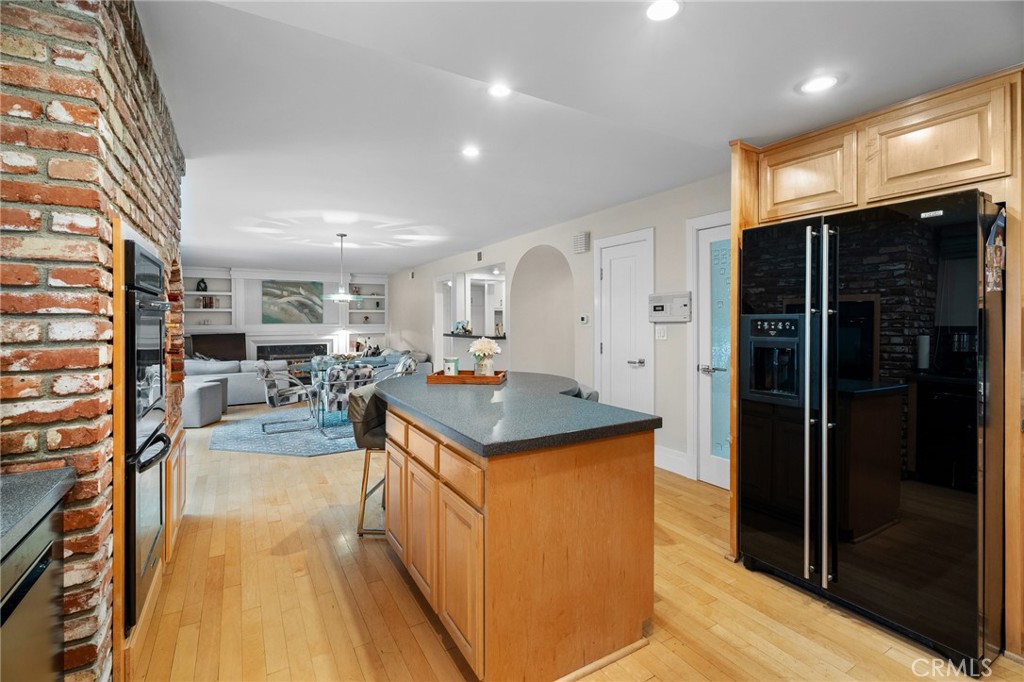 18927 Granada Circle Porter Ranch, CA 91326 - Photo 29 of 75 a view of a kitchen with kitchen island a sink a counter top space and stainless steel appliances