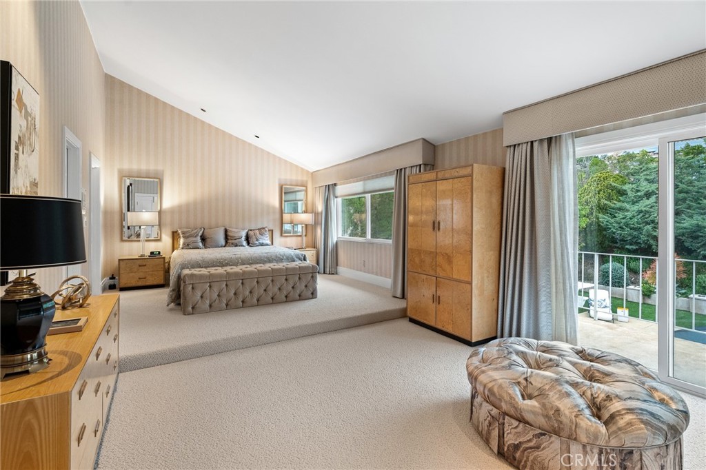 18927 Granada Circle Porter Ranch, CA 91326 - Photo 34 of 75 a spacious bedroom with a bed and large windows