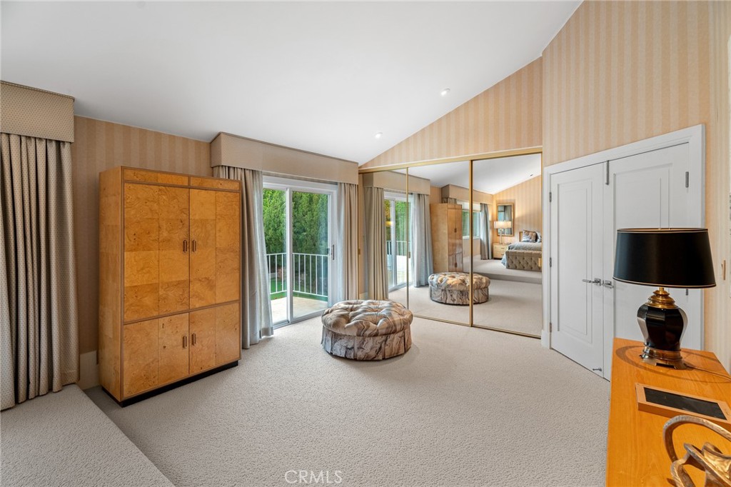 18927 Granada Circle Porter Ranch, CA 91326 - Photo 37 of 75 a living room with furniture a flat screen tv and a large window