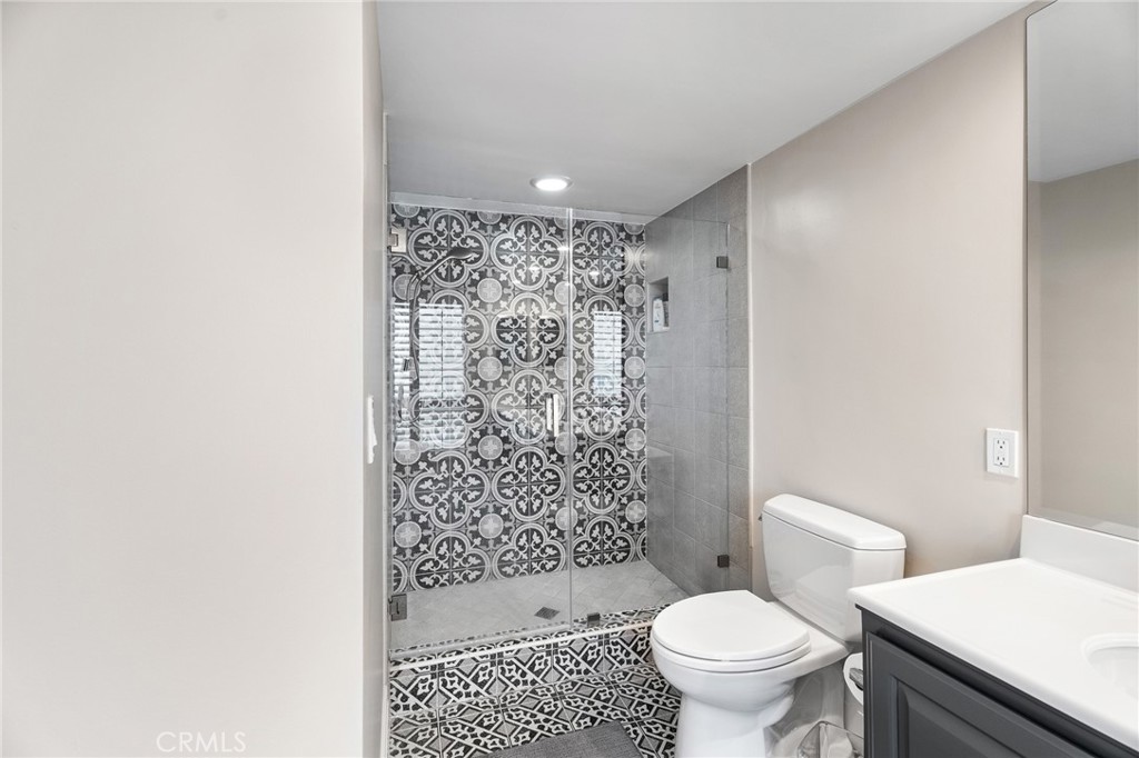 18927 Granada Circle Porter Ranch, CA 91326 - Photo 42 of 75 a bathroom with a toilet and a shower