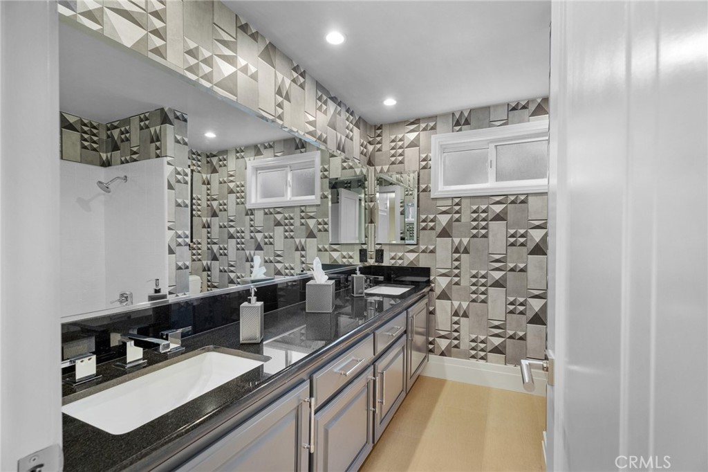 18927 Granada Circle Porter Ranch, CA 91326 - Photo 47 of 75 a kitchen with stainless steel appliances a sink stove and cabinets