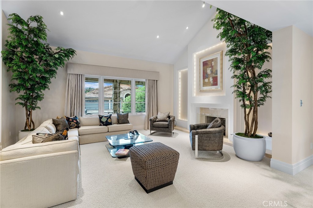 18927 Granada Circle Porter Ranch, CA 91326 - Photo 5 of 75 a living room with furniture potted plant and a window