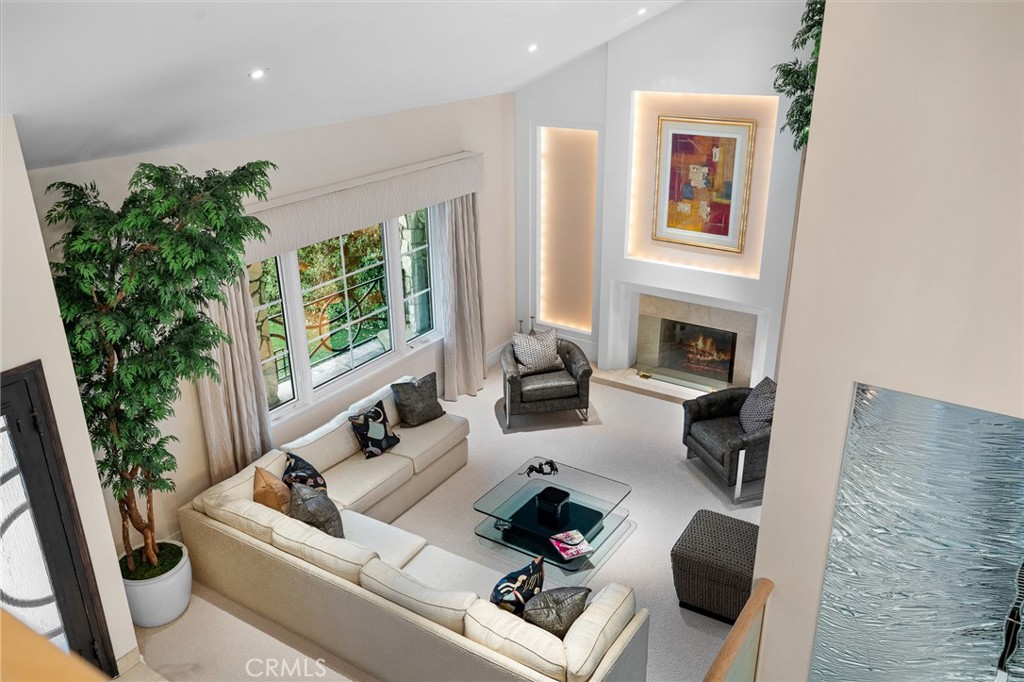 18927 Granada Circle Porter Ranch, CA 91326 - Photo 52 of 75 a living room with furniture and a fireplace