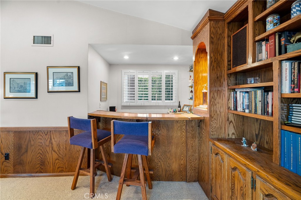 18927 Granada Circle Porter Ranch, CA 91326 - Photo 59 of 75 a view of a workspace with furniture and a window
