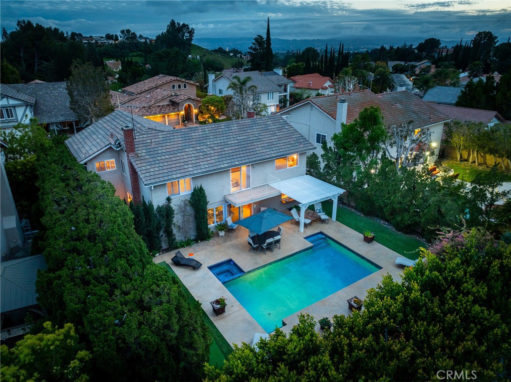 18927 Granada Circle Porter Ranch, CA 91326 - Photo 72 of 75 an aerial view of a house with swimming pool patio and outdoor seating