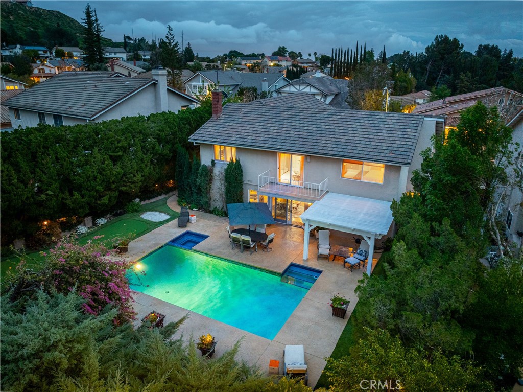 18927 Granada Circle Porter Ranch, CA 91326 - Photo 73 of 75 an aerial view of a house with a garden and swimming pool