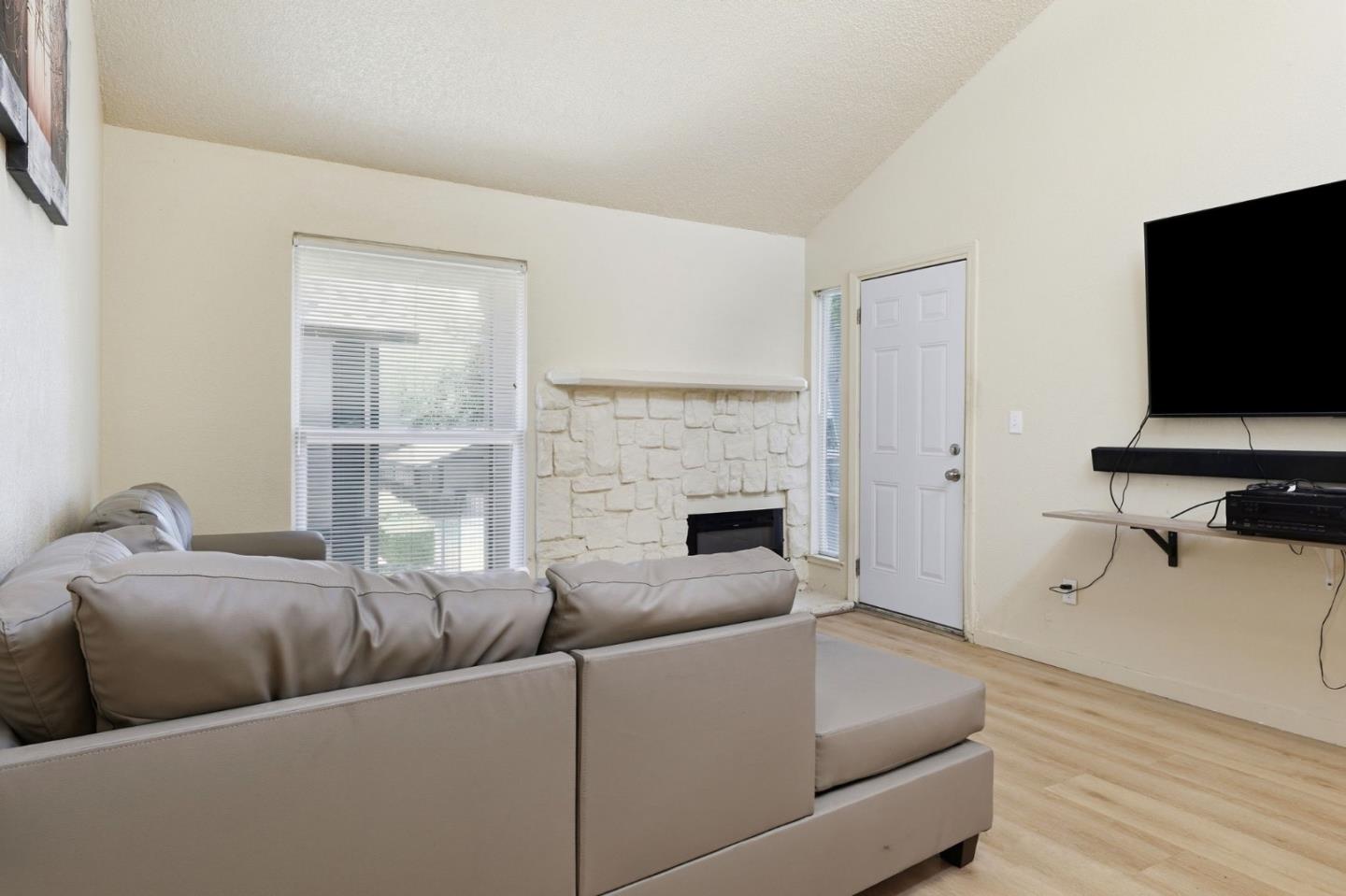 7283 Florin Road, Unit 8 Sacramento, CA 95828 - Photo 7 of 35 a living room with furniture and a flat screen tv