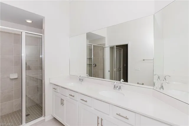 a spacious bathroom with a toilet sink and mirror