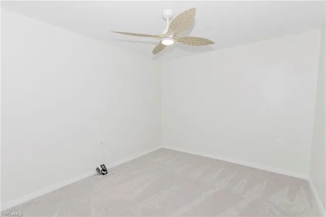 an empty room with white cabinet