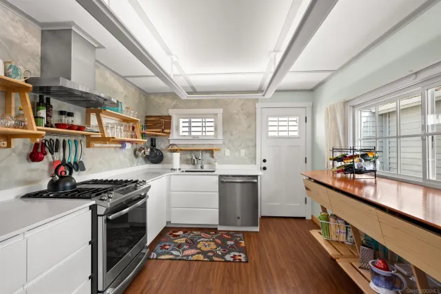 a kitchen with a stove and cabinets