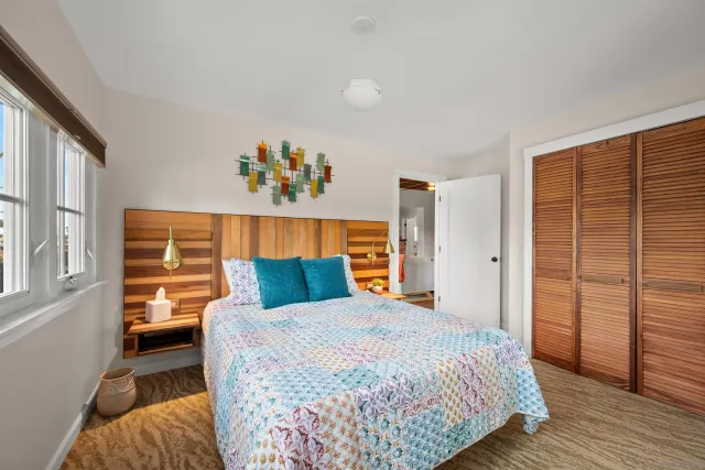 a bathroom with a double vanity sink a toilet and a shower