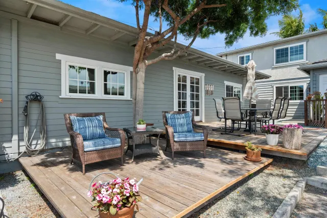 a view of a patio with couches and a table and chairs