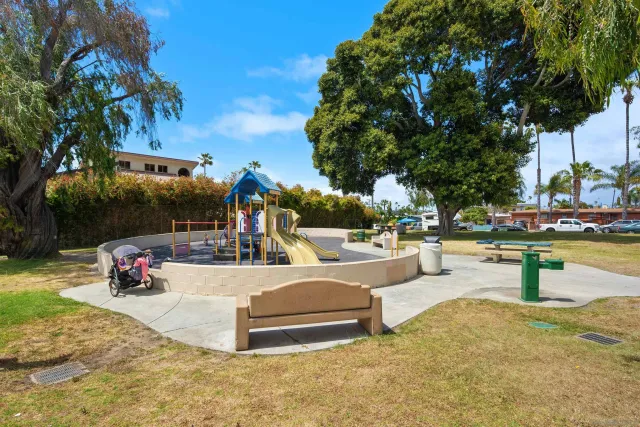 a view of a swimming pool and lounge chairs