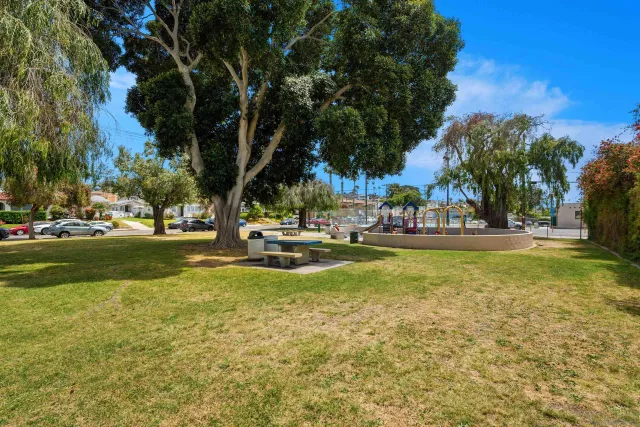 a swimming pool with outdoor seating and yard