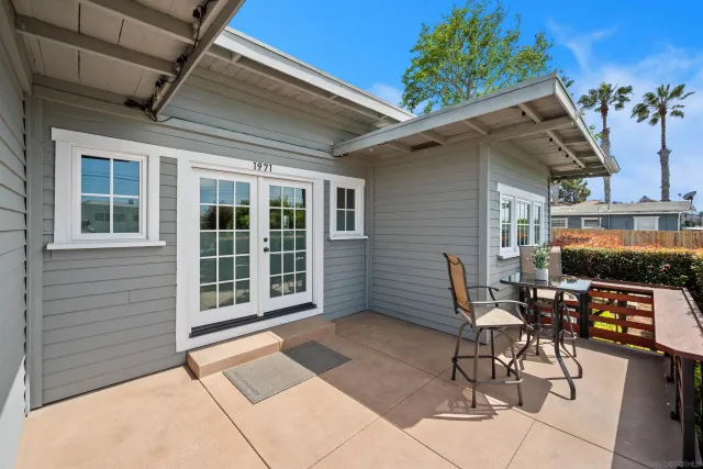 a living room with furniture a fireplace and a table