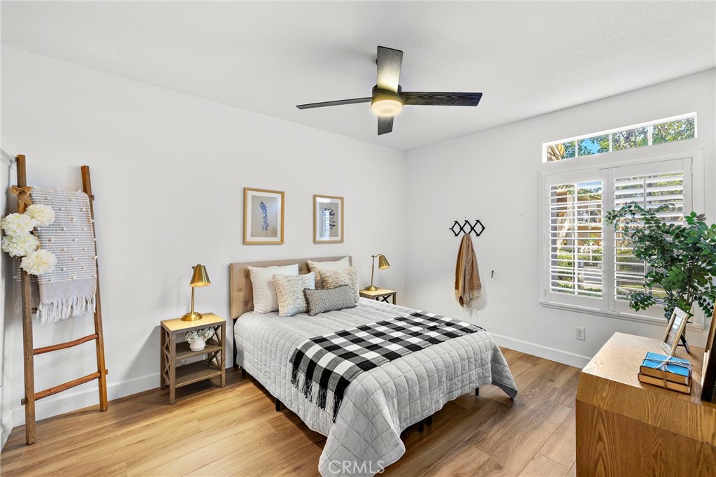 9 Violado Rancho Santa Margarita, CA 92688 - Photo 19 of 41 a bedroom with a bed and wooden floor